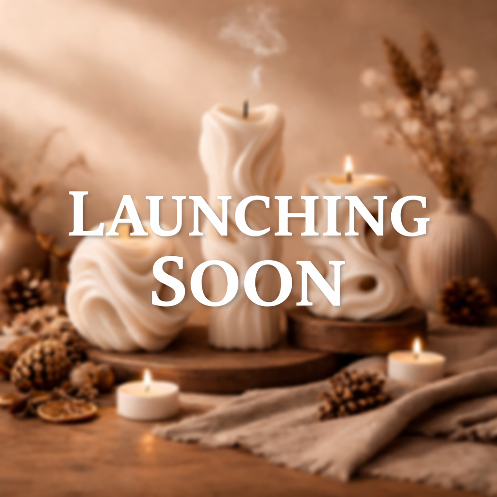 Candle with smoke, pinecones, and text 'LAUNCHING SOON' on a warm-toned background.